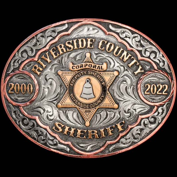 Add a traditional western flare to any outfit with the Livingston Custom Belt Buckle. Crafted on an oval, German Silver base. Detailed with beautiful hand-engraved overlays, a Copper edge, and Jewelers Bronze lettering. 

Customize it with your letterin